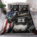 Baseball quilt blanket styled in a bedroom with batter artwork and patriotic red, white, and blue accents