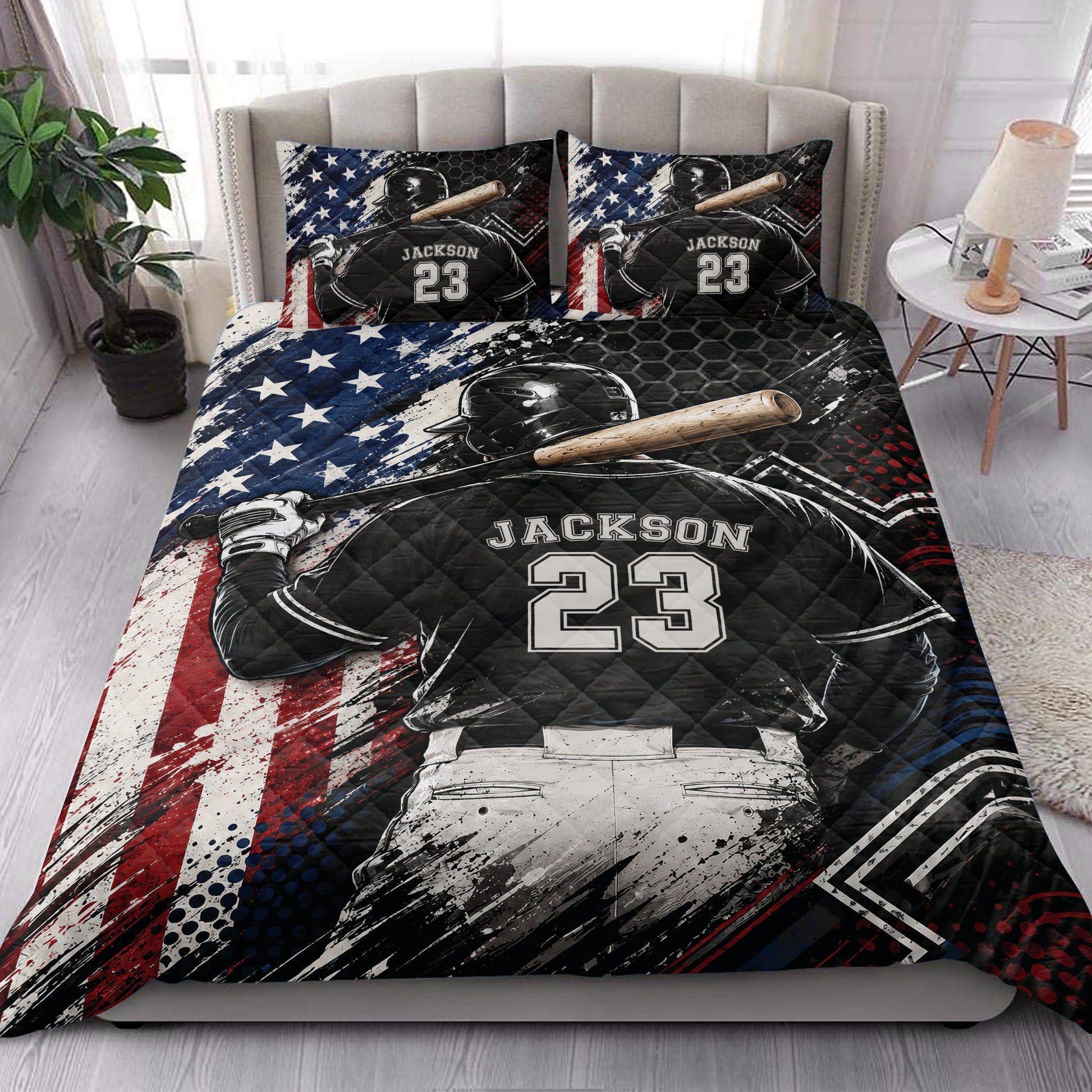Baseball quilt blanket styled in a bedroom with batter artwork and patriotic red, white, and blue accents