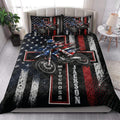 Motocross quilt bedding styled in a bright bedroom with dirt bike rider artwork