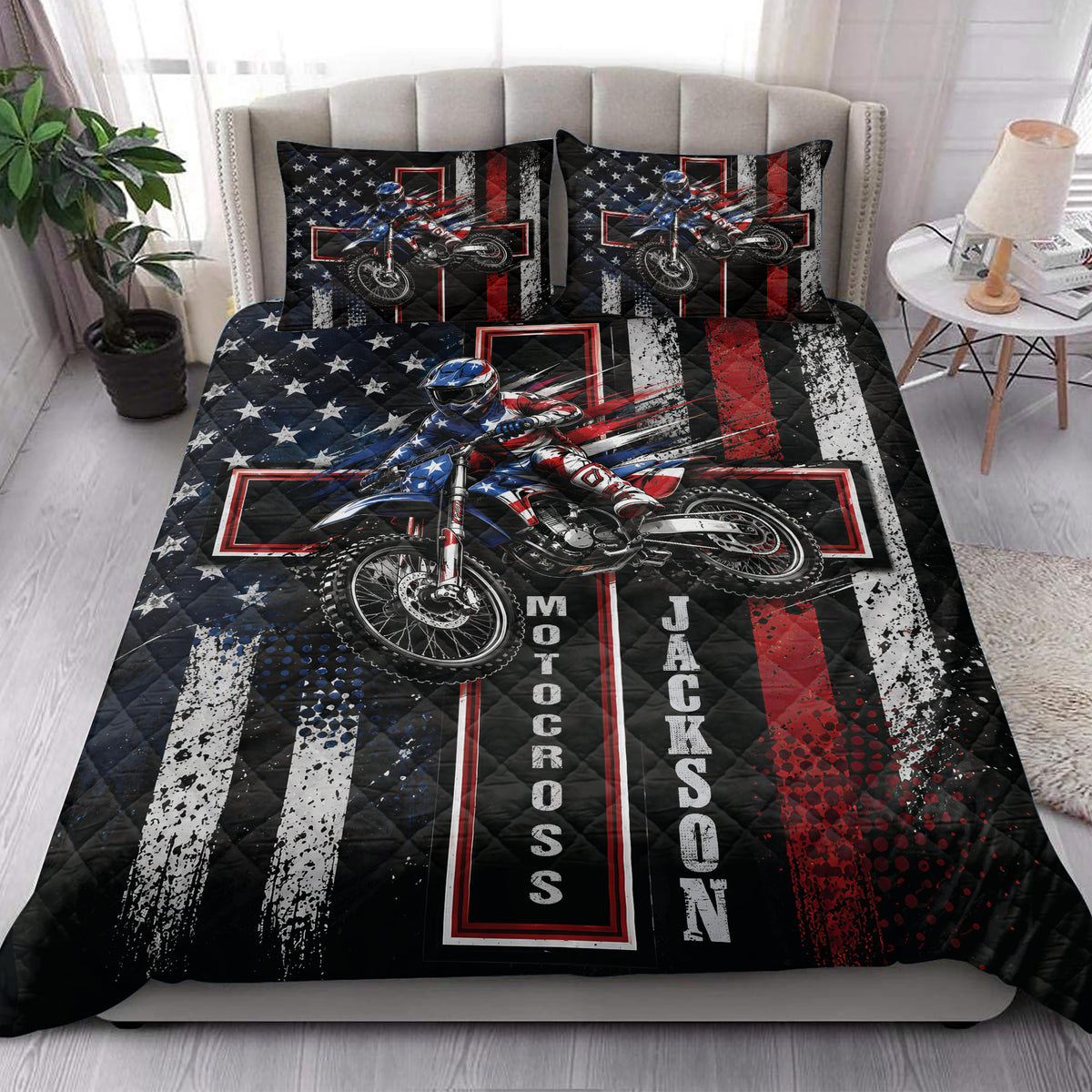 Motocross quilt bedding styled in a bright bedroom with dirt bike rider artwork