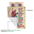 Softball quilt showing the colorful printed front and white quilted backing in a product detail view