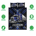 Trucker quilt bedding set with blue semi-truck artwork, black geometric accents, and care icons