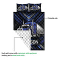 Blue semi-truck quilt showing the printed front and quilted white backing detail
