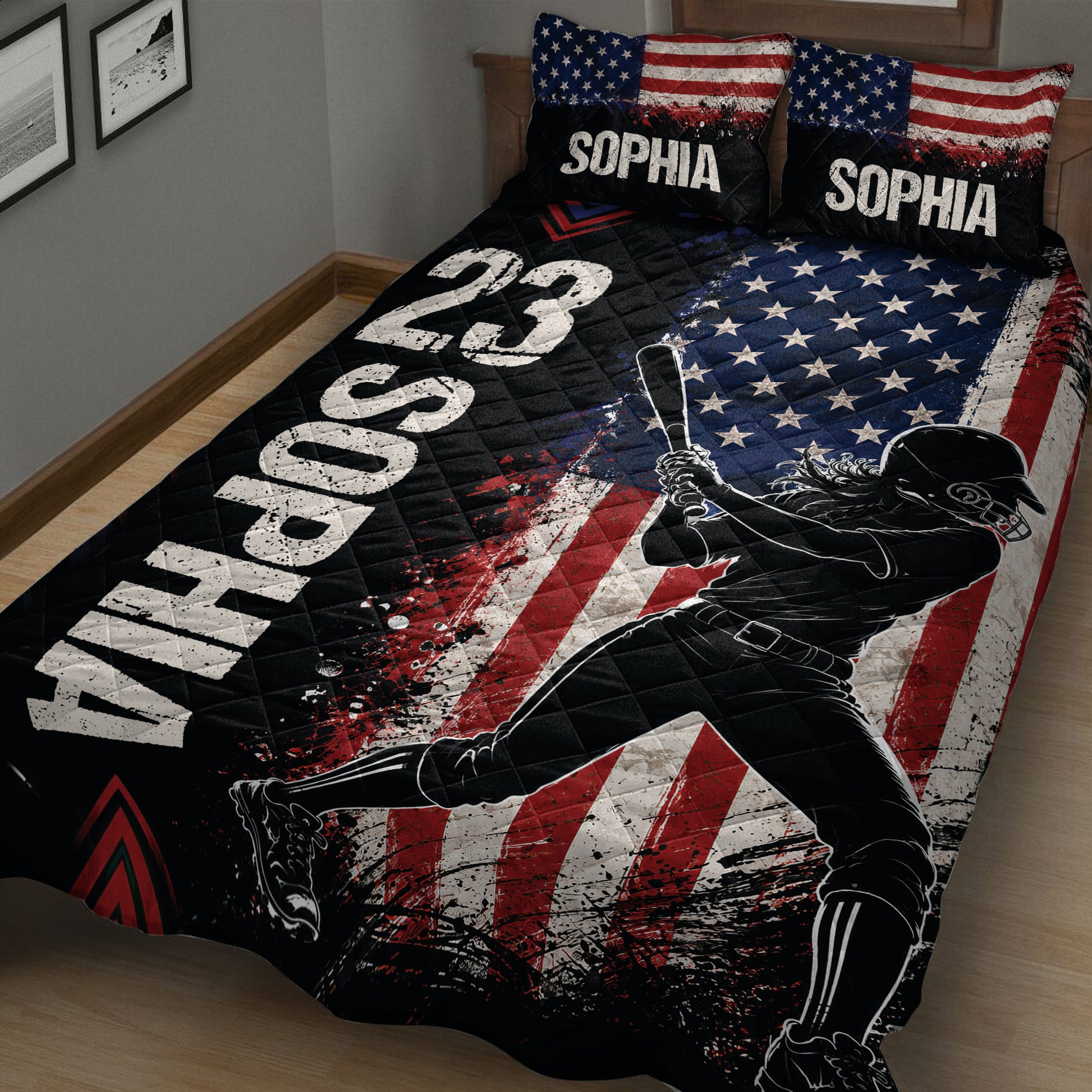 Close bedroom view of a softball quilt blanket with batter artwork, stars, stripes, and bold colors