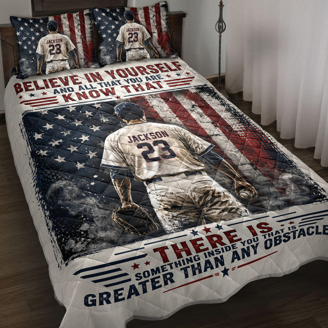Baseball quilt blanket displayed on a bed with player artwork, patriotic stars and stripes, and motivational sports graphics