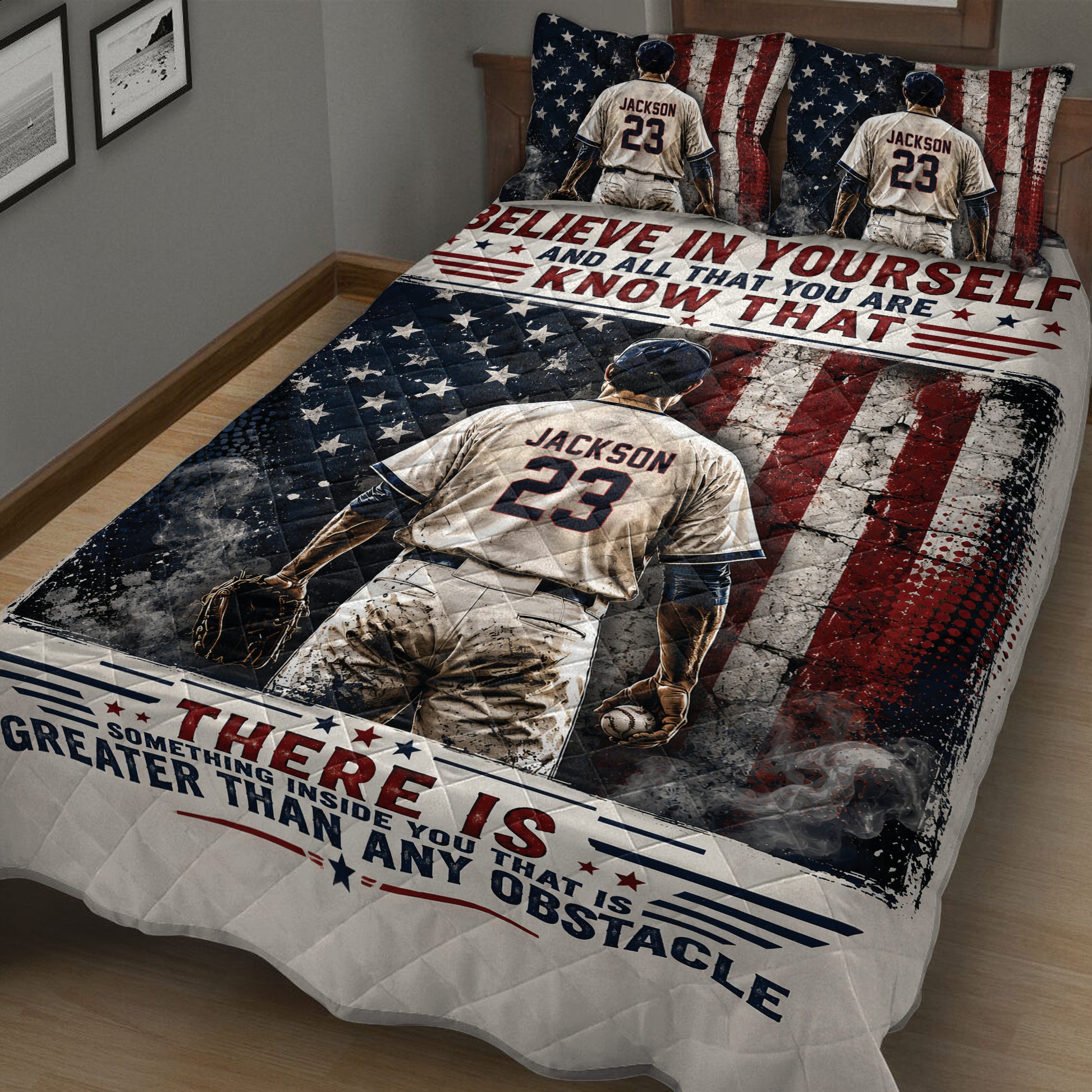 Close bedroom view of a baseball quilt blanket featuring a ballplayer, glove, baseball, and patriotic artwork