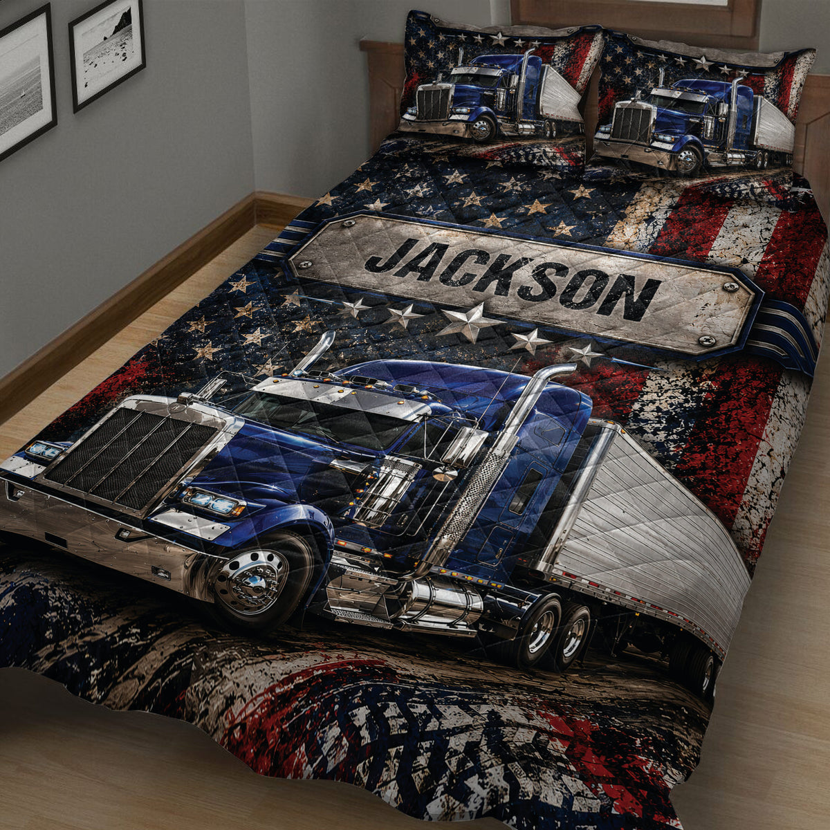Close-up of a trucker quilt blanket featuring a large blue semi-truck, stars, and rugged patriotic artwork