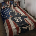 Baseball quilt blanket displayed on a bed with batter artwork and rustic patriotic flag design