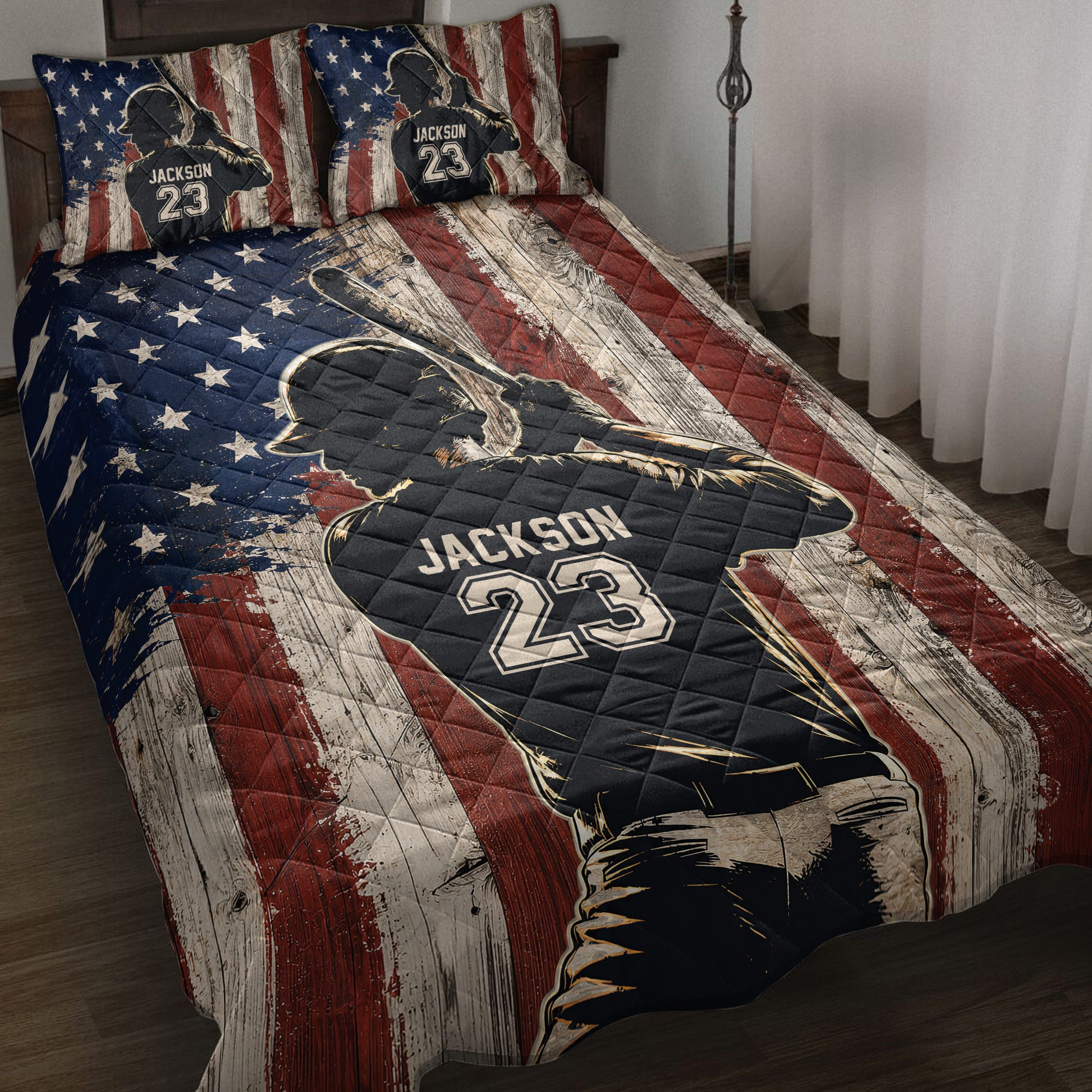 Baseball quilt blanket displayed on a bed with batter artwork and rustic patriotic flag design