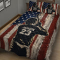 Baseball quilt bedding displayed on a bed with vintage wood flag artwork and batter design