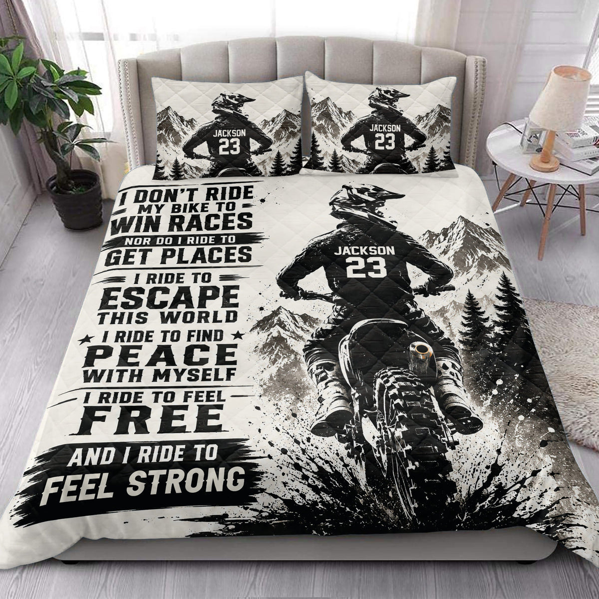 Motocross quilt bedding styled in a bedroom with dirt bike rider, mountain landscape, and bold monochrome graphics