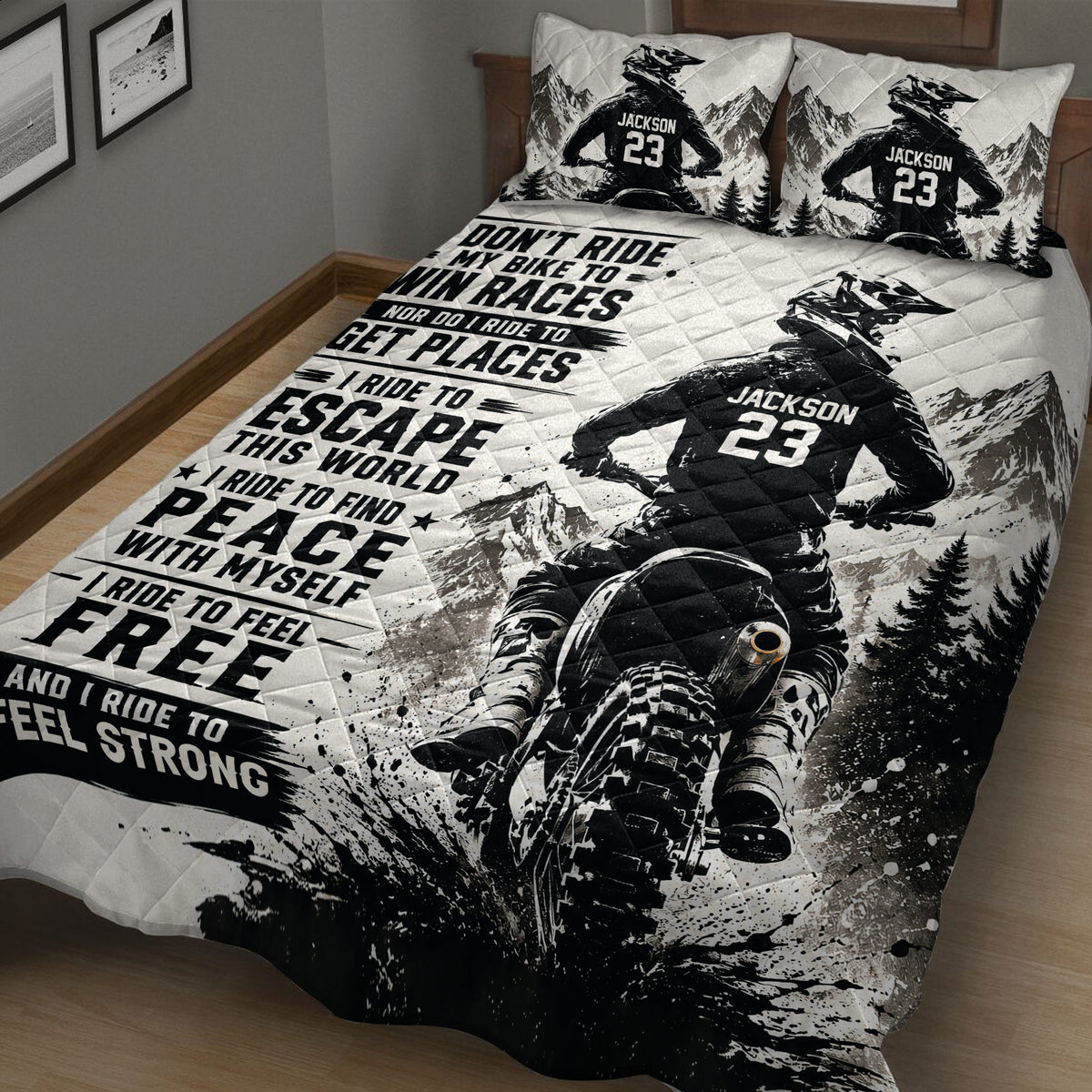 Dirt bike motocross quilt blanket shown across a bed with mountain scenery and dramatic black and white racing artwork