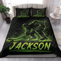 Black and neon green hockey quilt bedding styled on a bright bedroom bed with matching pillows