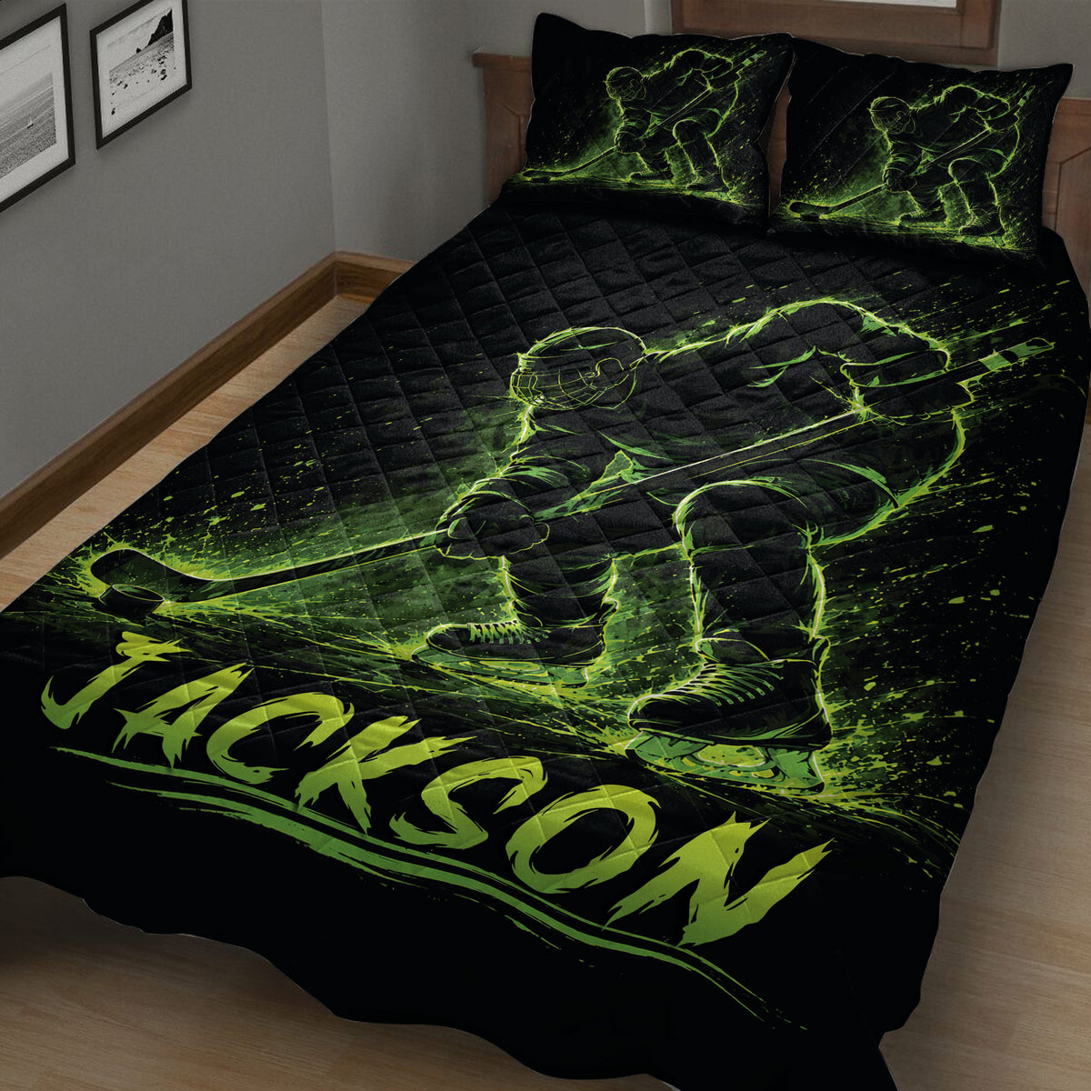 Close bedroom view of a black hockey quilt featuring neon green skaters, sticks, and puck artwork