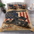 Dirt track racing quilt bedding styled on a bedroom bed with sprint car artwork and patriotic colors