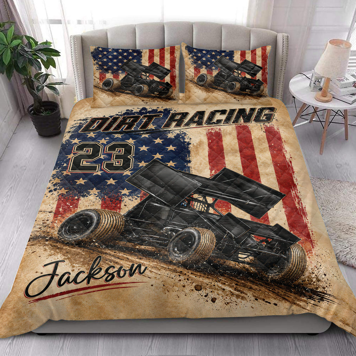 Dirt track racing quilt bedding styled on a bedroom bed with sprint car artwork and patriotic colors