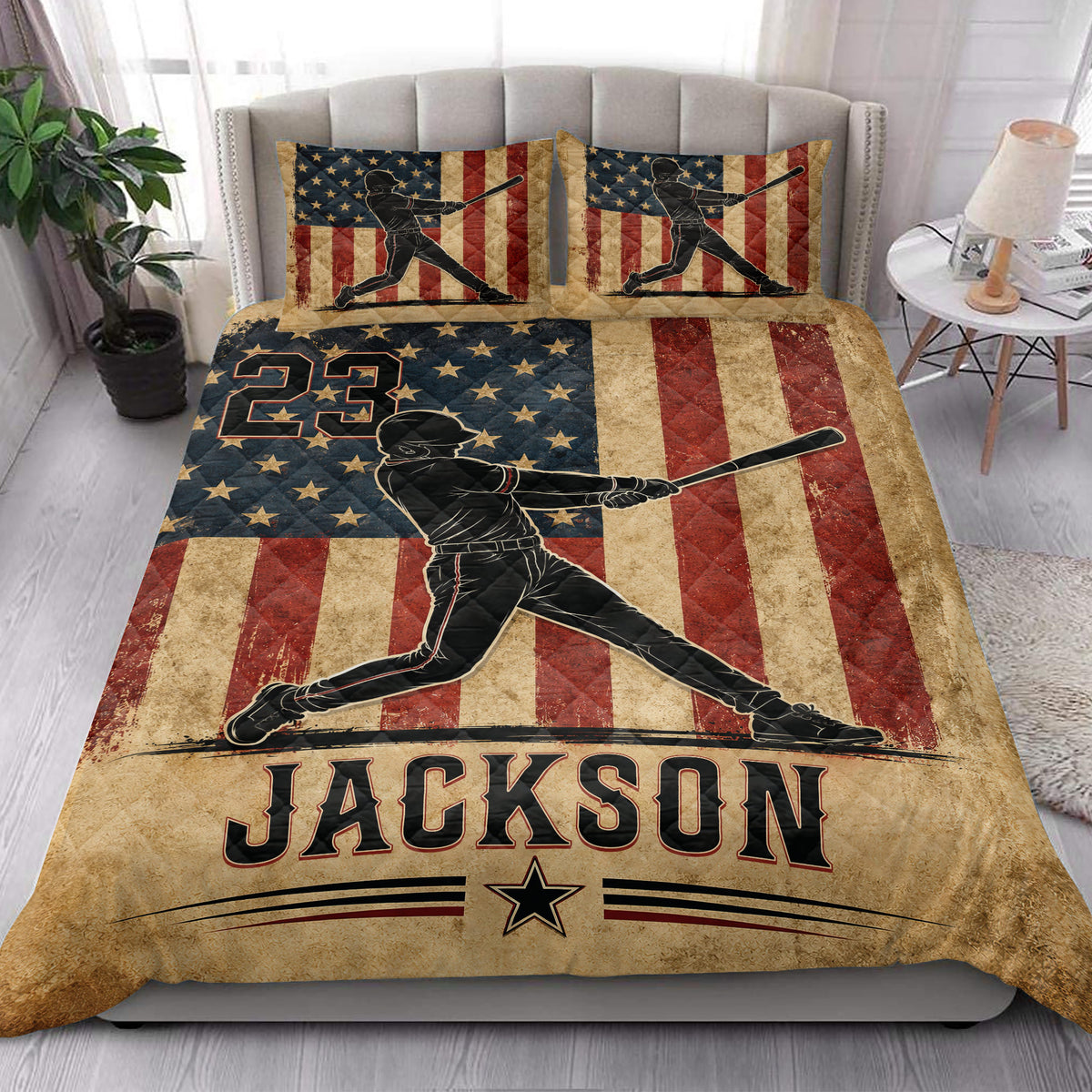 Patriotic baseball quilt styled on a bedroom bed with batter artwork and star-spangled stripes