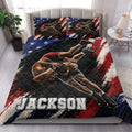 Wrestling quilt bedding styled on a bedroom bed with bold patriotic colors and athlete artwork