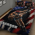 Close bedroom view of a wrestling quilt blanket featuring grappling athletes and dynamic sports artwork