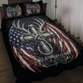 Hunting quilt blanket on a bed with deer antlers, feathers, anchor artwork, and patriotic red, white, and blue colors