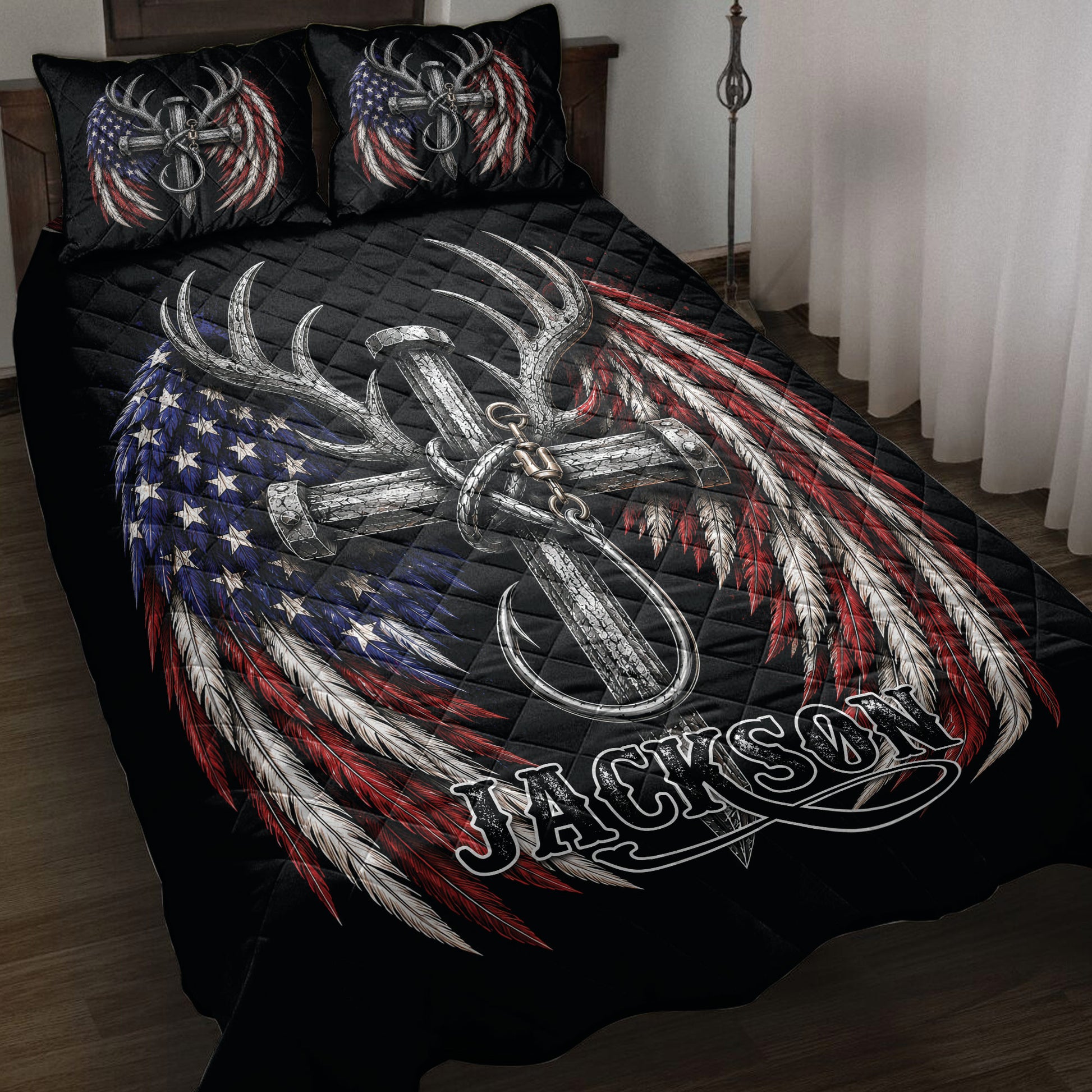 Hunting quilt blanket on a bed with deer antlers, feathers, anchor artwork, and patriotic red, white, and blue colors