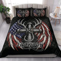 Hunting quilt blanket styled on a bedroom bed with matching antler and feather artwork