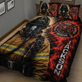 Close bedroom view of a firefighter quilt featuring a protective helmet, turnout gear, flames, and rescue emblem