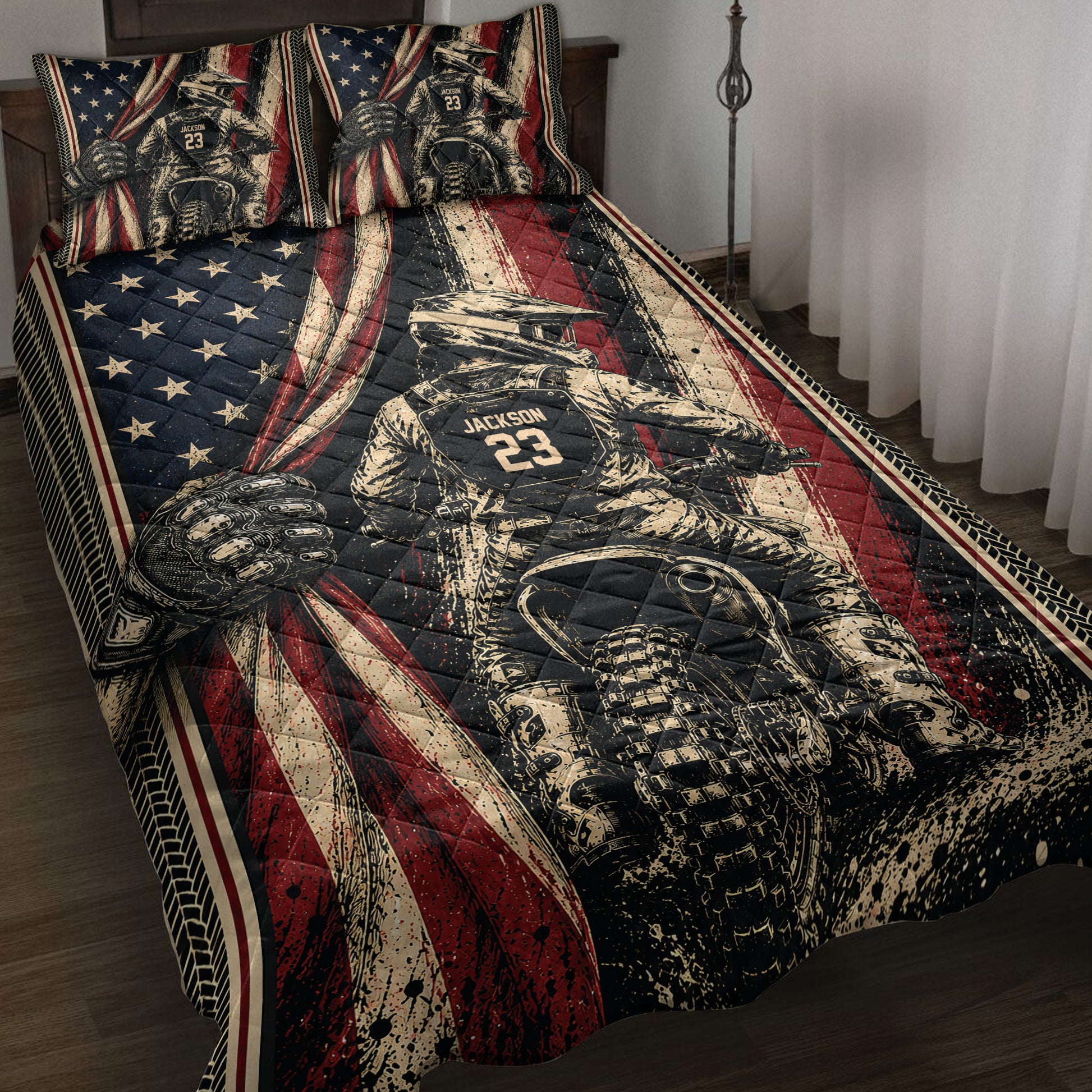 Motocross quilt blanket bedding set displayed on a bed with dirt bike rider artwork and red, black, cream, and navy racing colors.