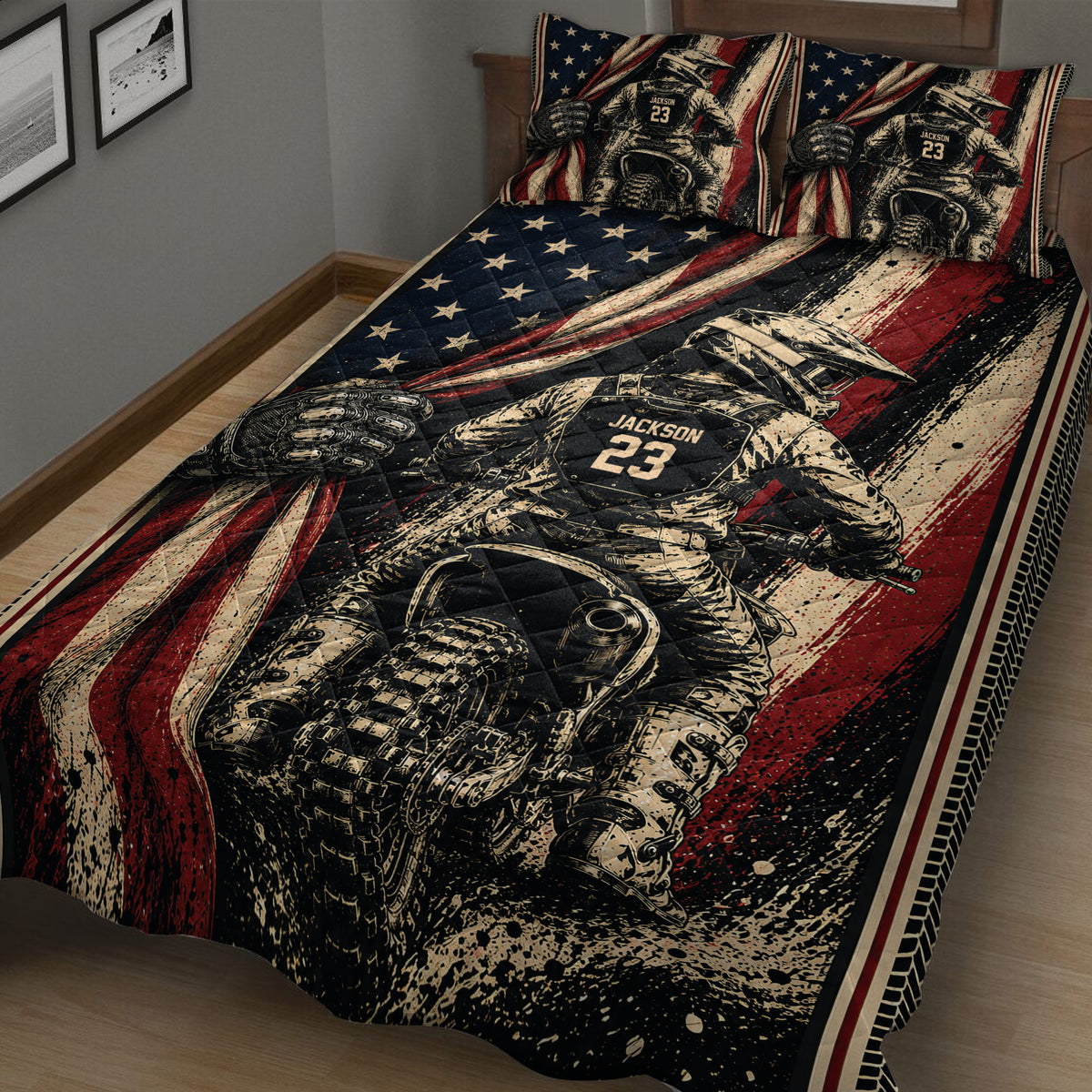Angled bedroom view of a motocross quilt blanket featuring a helmeted dirt bike rider and dramatic red, black, and cream artwork.