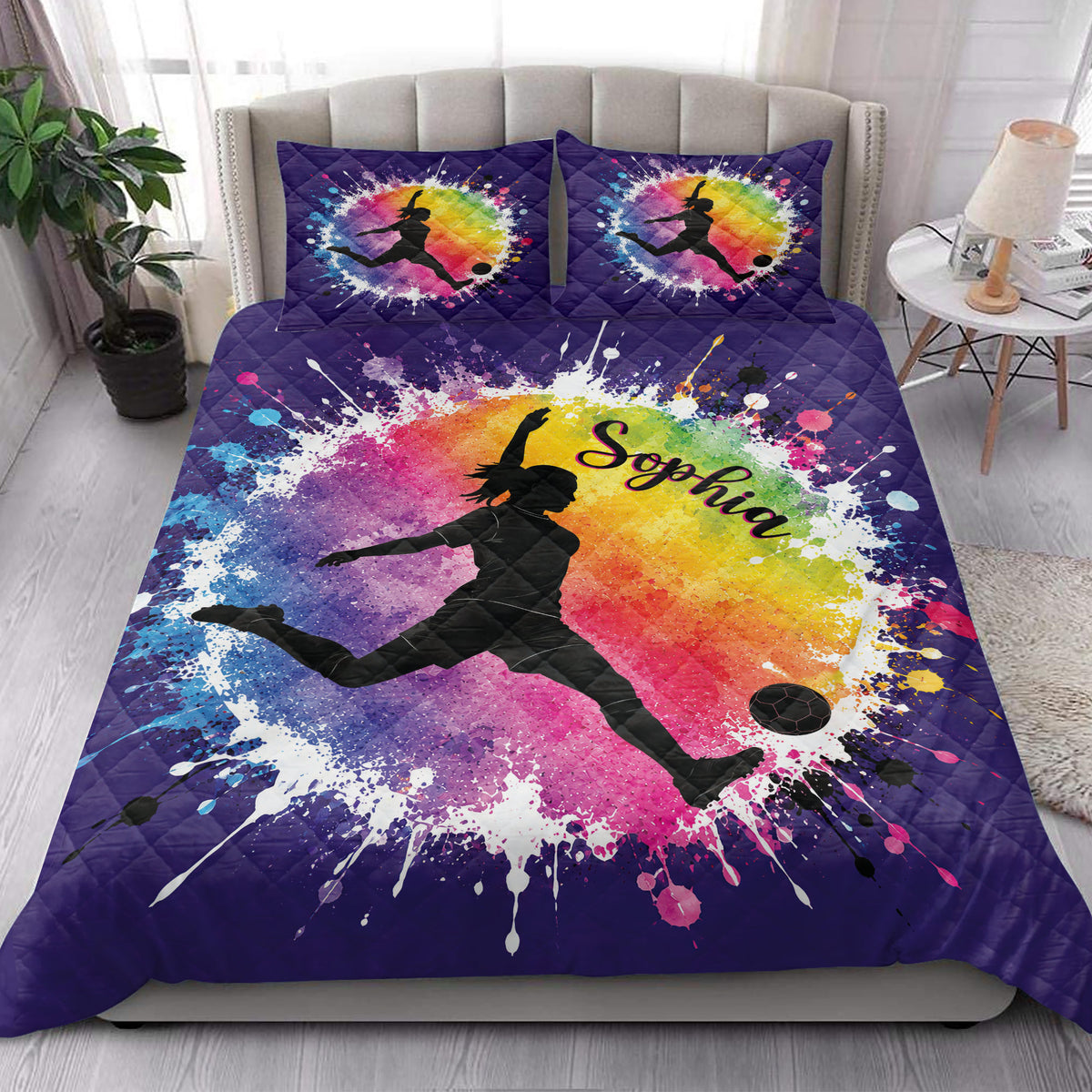 Soccer quilt bedding styled in a bright bedroom with colorful female player artwork and purple quilted borders