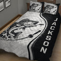 Close view of fishing quilt bedding featuring a large fish, lure, rod, and monochrome bedroom design