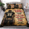 Football bedding set styled in a bright bedroom with player artwork across the quilt and pillow surfaces