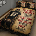 Close view of football quilt blanket featuring a helmeted player, football, and bold motivational sports artwork