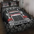 Trucker quilt blanket on a bed with a red semi truck, dark rocky border, and bold black and silver artwork