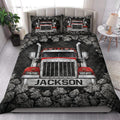 Trucker quilt blanket styled on a bedroom bed with a large red semi truck design and matching pillowcases