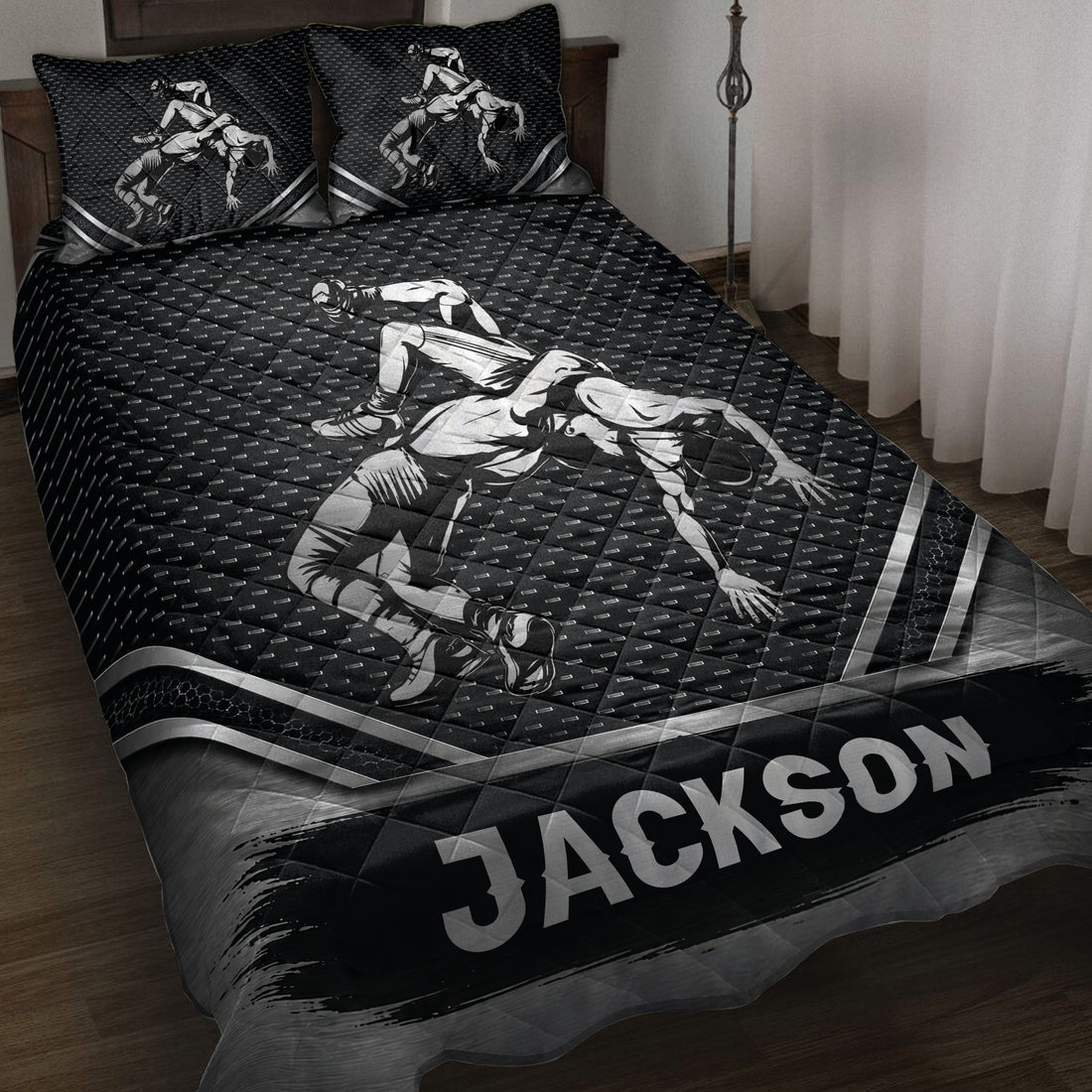 Black wrestling quilt bedding set displayed on a bed with grappling artwork and matching pillow designs