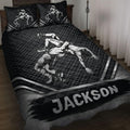 Black wrestling quilt bedding set displayed on a bed with grappling artwork and matching pillow designs