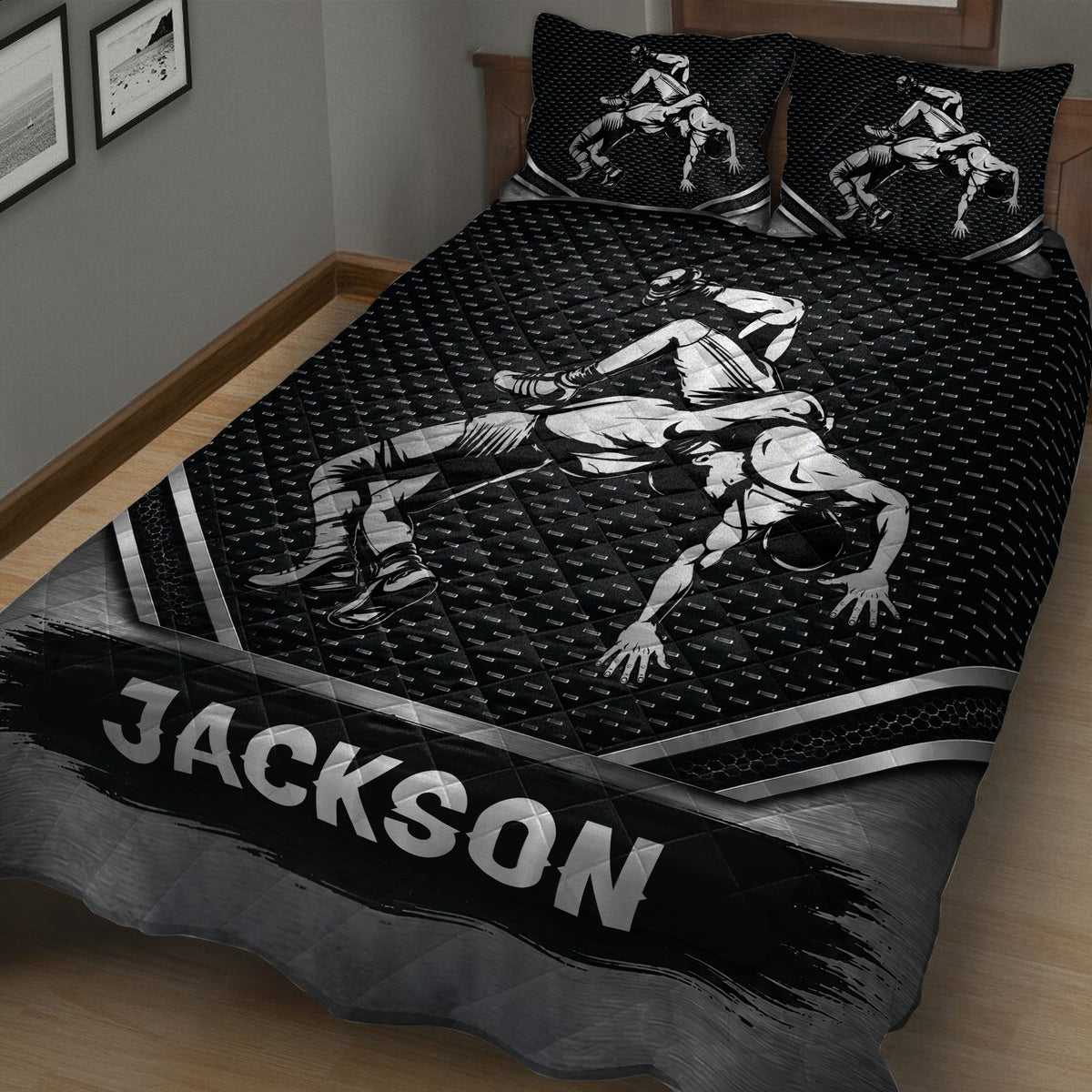Black wrestling quilt displayed on a bed with dynamic grappling artwork and geometric sports pattern