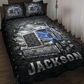 Trucker quilt bedding set displayed on a bed with a blue semi truck, black diamond pattern, and dramatic metallic artwork