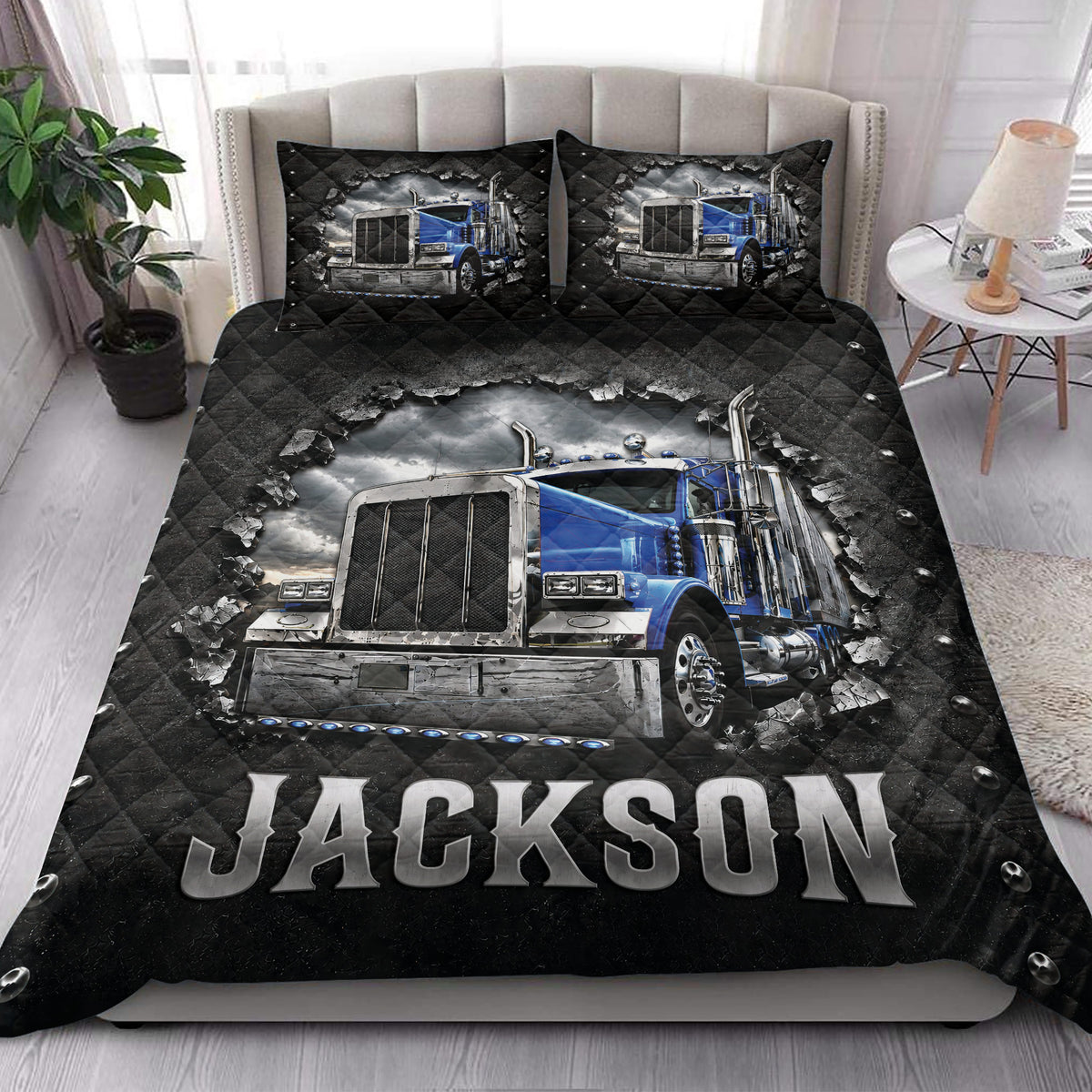 Trucker quilt bedding displayed in a bedroom with blue semi truck artwork and bold black and silver styling