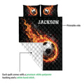 Soccer quilt showing a fiery ball design, printed front, and white quilted reverse