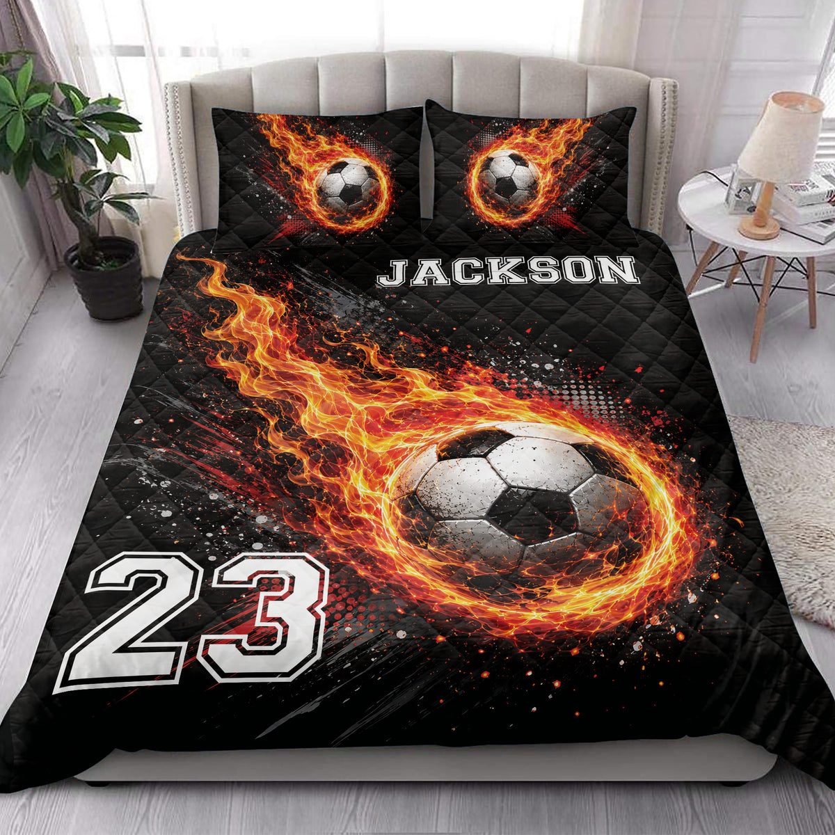 Soccer quilt bedding styled on a bedroom with dramatic flaming ball artwork