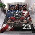 Football quilt bedding set styled on a bedroom bed with red, blue, and white player artwork