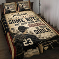 Patriotic baseball quilt blanket displayed on a bed with a ballplayer, glove, stars, and vintage sports artwork