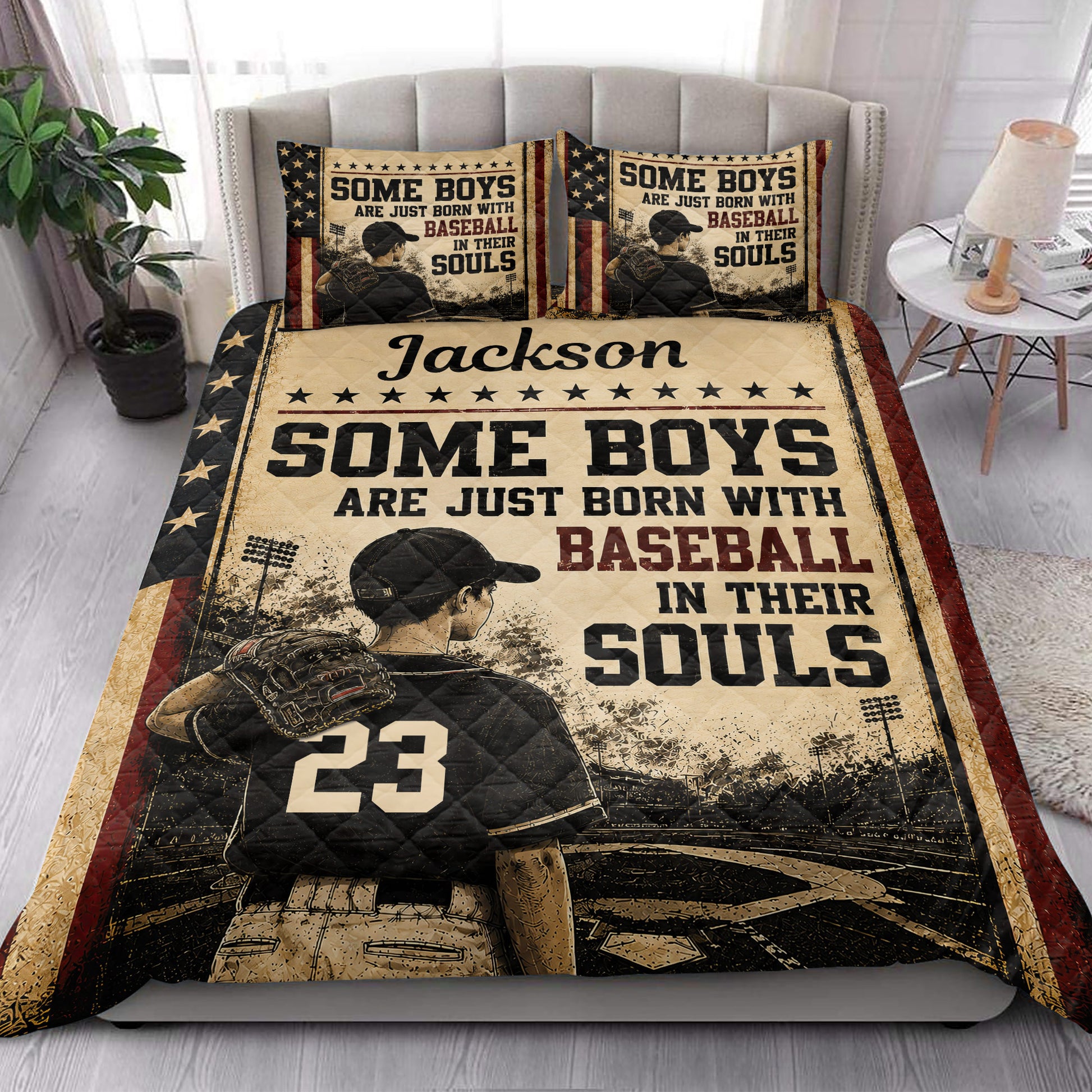 Baseball quilt blanket styled in a bedroom with patriotic colors, ballplayer artwork, stars, and vintage sports details