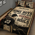 Close bedroom view of a baseball quilt blanket featuring a ballplayer, glove, star border, and vintage patriotic design