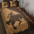 Rodeo quilt blanket displayed on a bed with cowboy rider, horse, boot, and Western brown and tan artwork