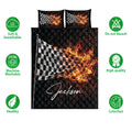 Racing quilt blanket and pillowcases shown with breathable, washable, and colorfast feature icons