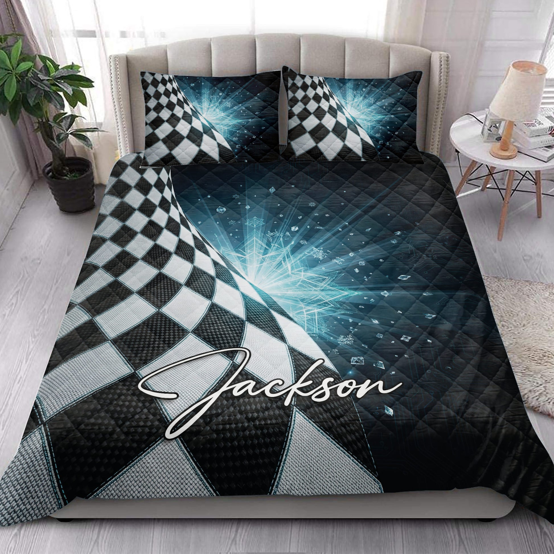Racing quilt bedding set styled in a bright bedroom with bold checkered flag artwork and blue geometric details