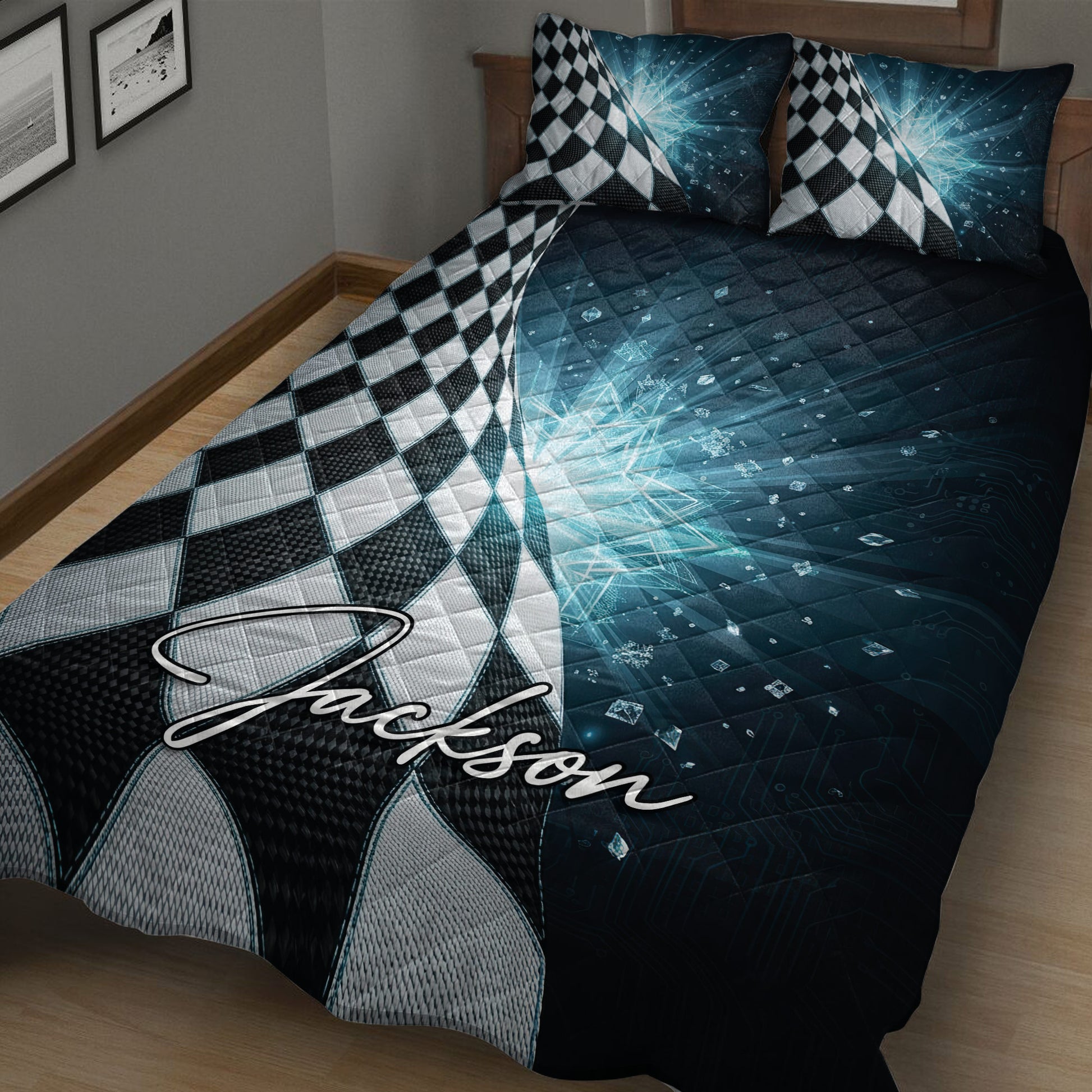 Close bedroom view of a racing quilt blanket featuring black and white checkered flags and deep blue graphics